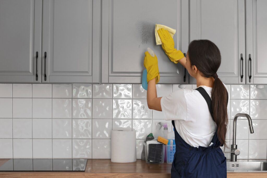 medium-shot-woman-cleaning-home-min